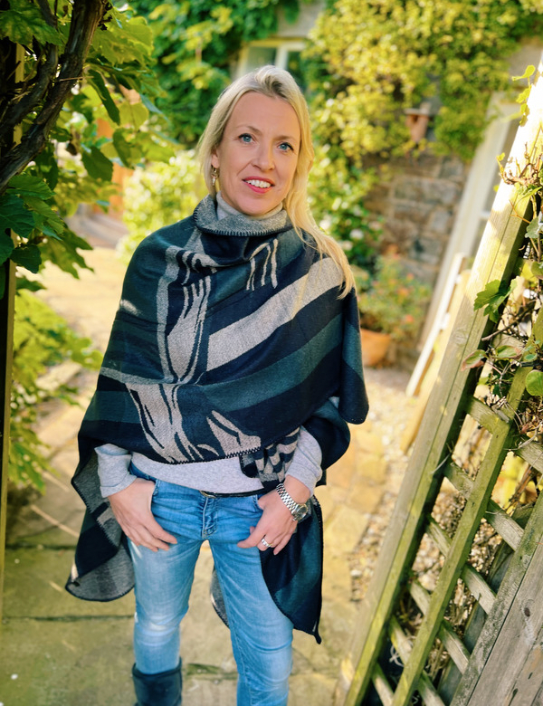 Woman wearing cashmere blend Warrior Wrap in navy