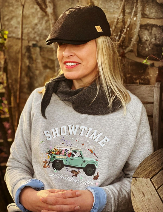 Woman wearing grey Showtime Sweat and charcoal neck scarf