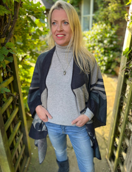 Woman wearing cashmere blend Warrior Wrap in navy