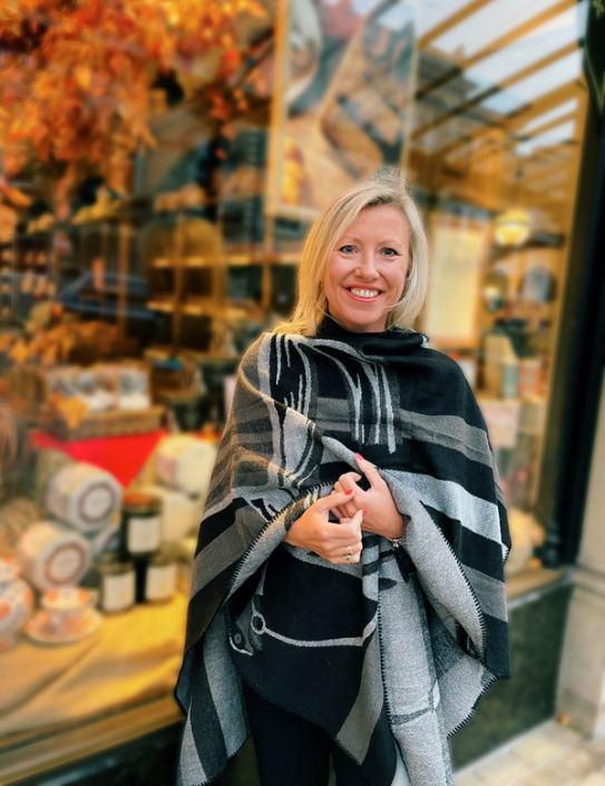 Woman wearing cashmere blend Warrior Wrap in black