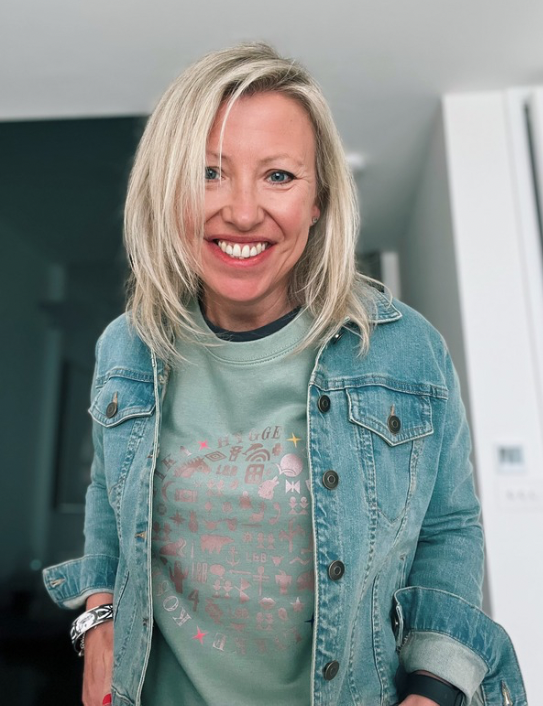 Woman wearing dusty green Scandi Sweat and denim jacket
