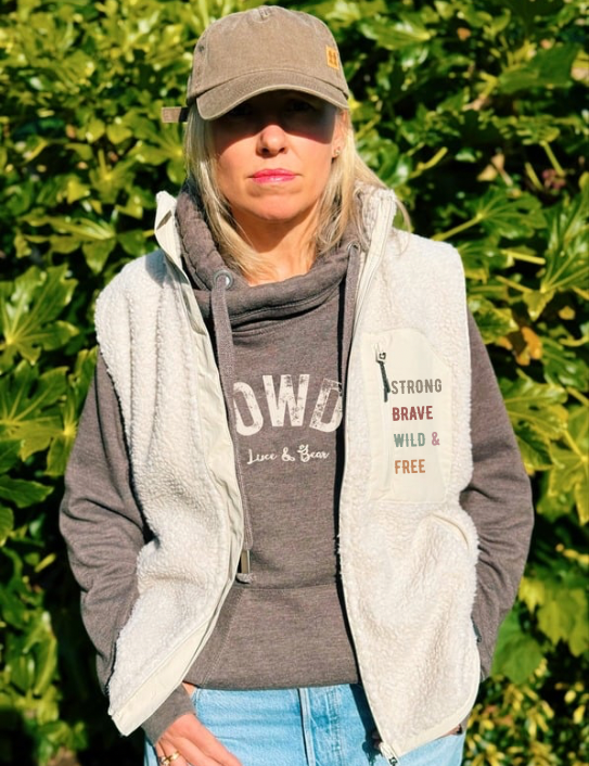 Woman wearing Howdy Hoodie in and Sherpa Gilet