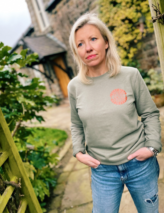 Woman wearing Vintage Power Sweatshirt in light khaki