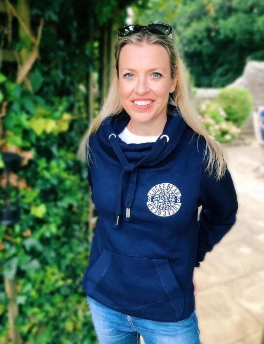 Woman wearing navy Power cross neck hoodie