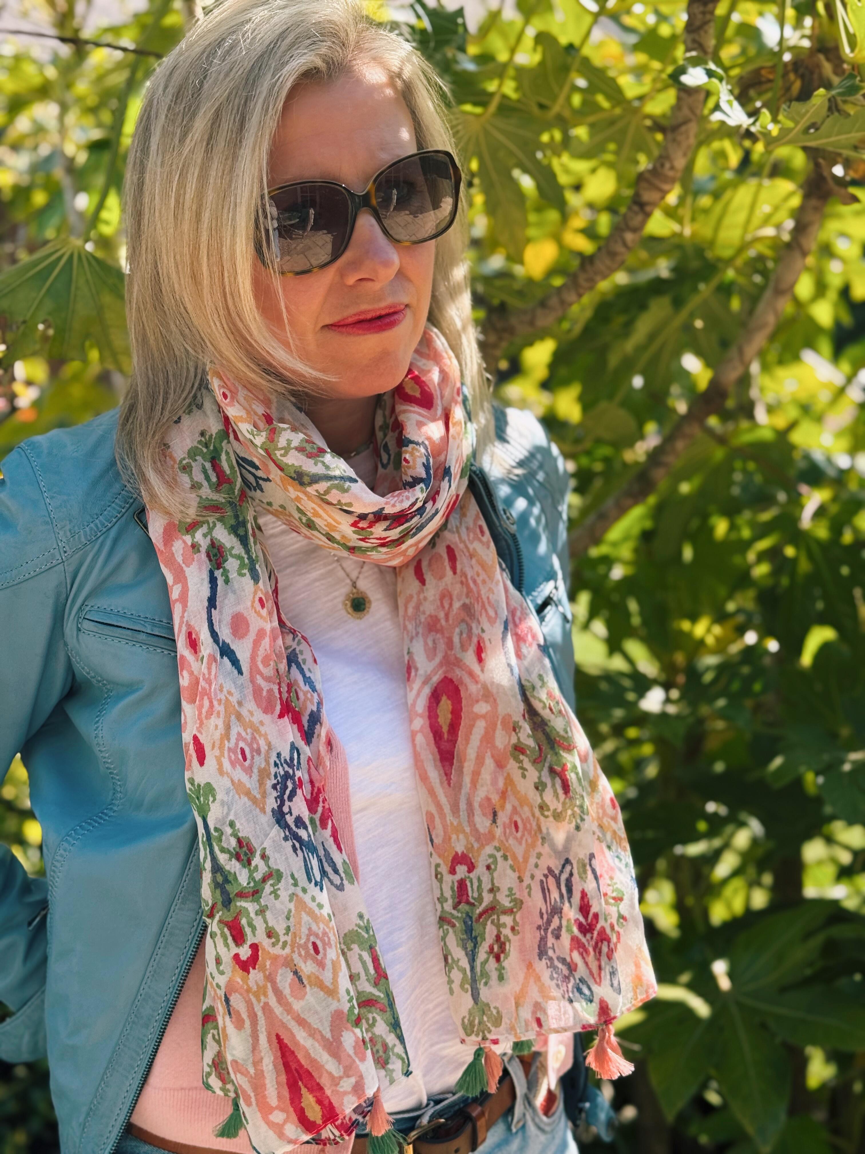 Woman wearing patterned abstract Ikat lightweight summer scarf