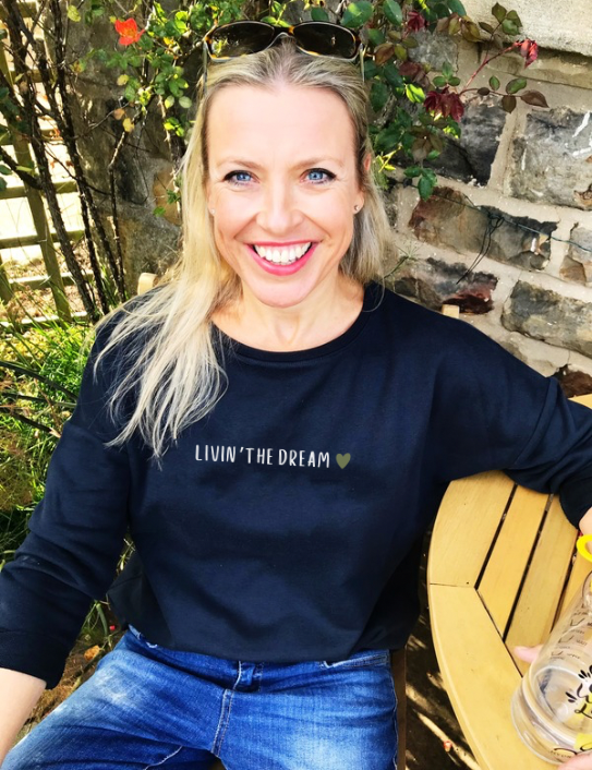 Woman wearing Livin the Dream Sweatshirt in navy