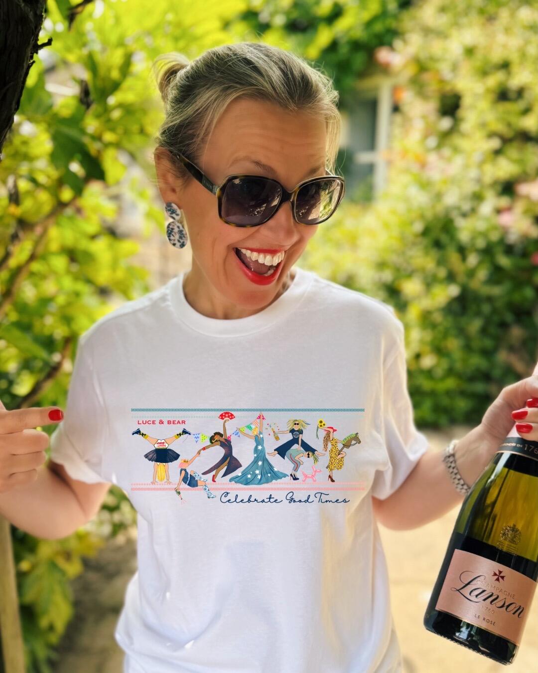 Woman wearing white Celebrate Good Times Tee