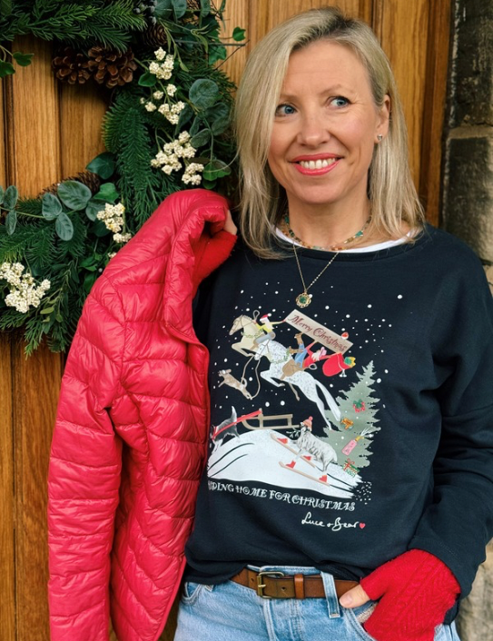 Woman wearing Riding Home for Christmas Sweatshirt