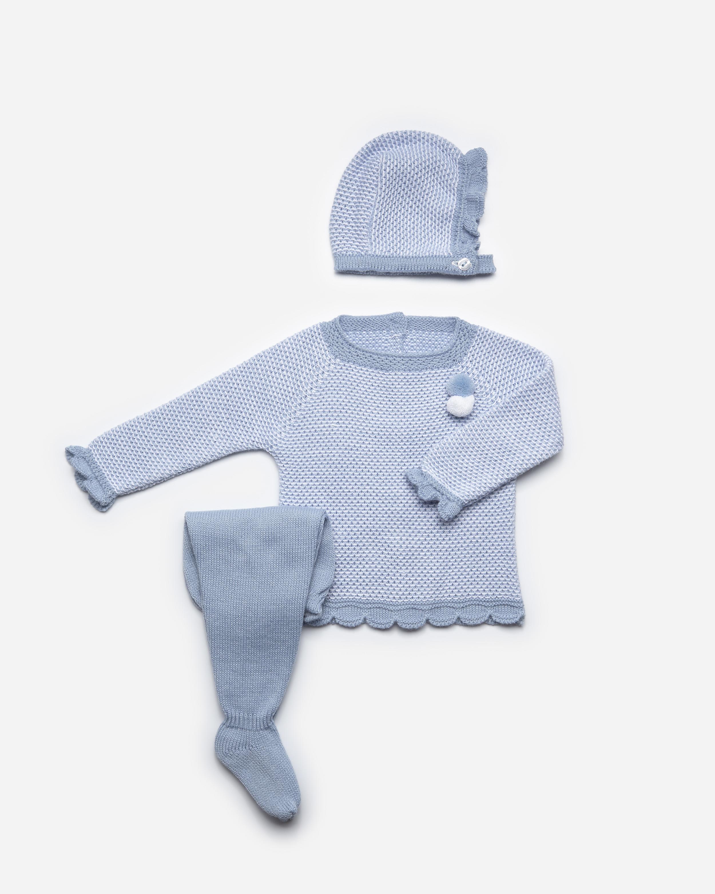 Blue knitted leggings jumper set with bonnet hat in same pattern. Pom Pom detail on the front of the jumper