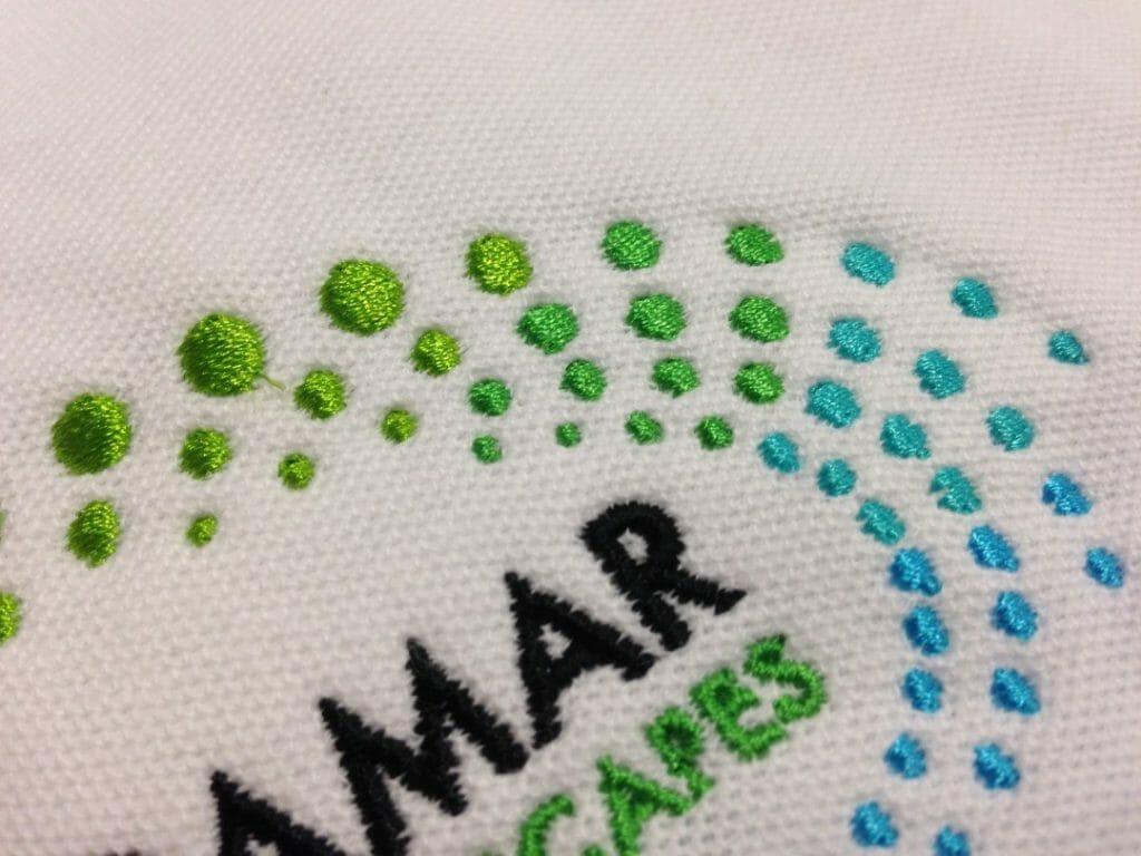 andamar embroidery green white blue polo detail