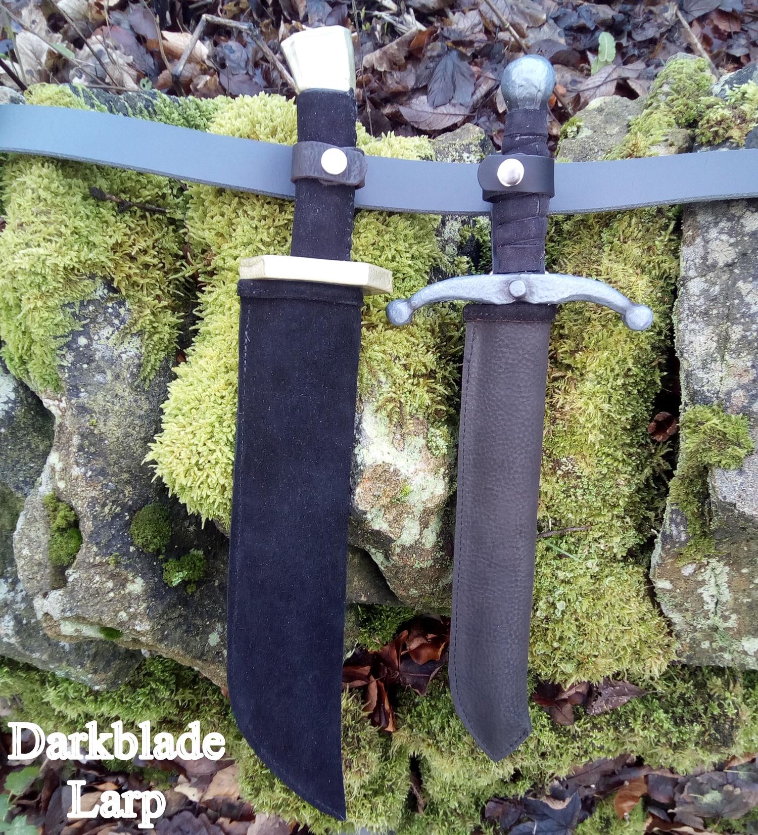 Two full dagger scabbards with daggers in them