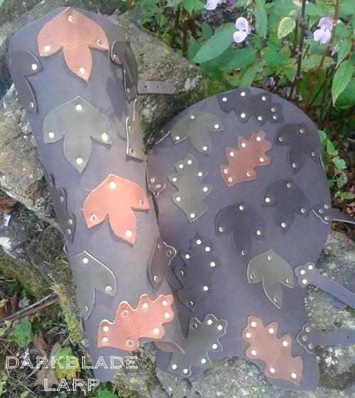 lower leg armour decorated with suede leaves