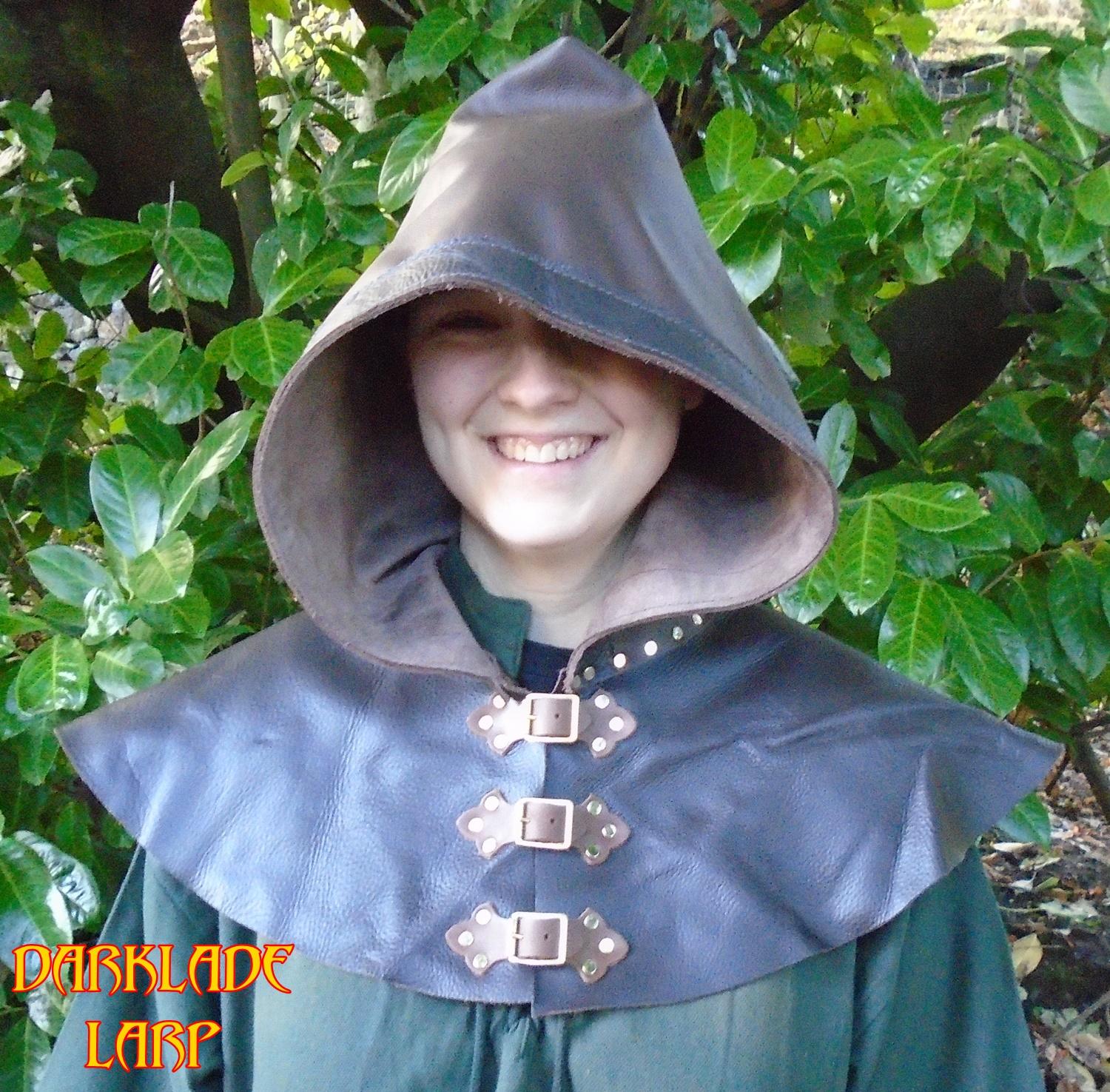 Brown leather hood with buckles at the front