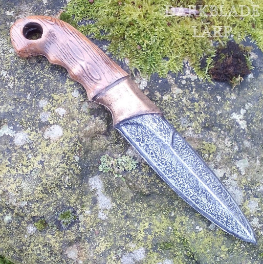 A larp throwing knife designed to look like a traditional hunting knife