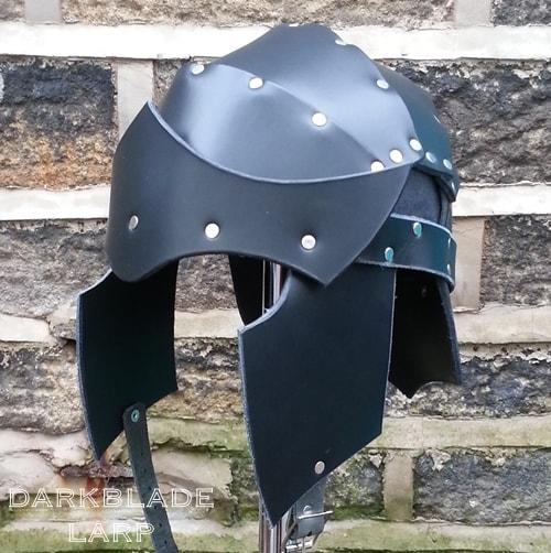 heavy leather helmet with an open face with cheek protectors