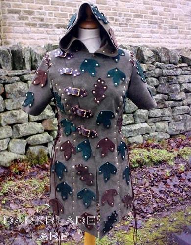 ladies suede jacket with a hood, decorated with leaves