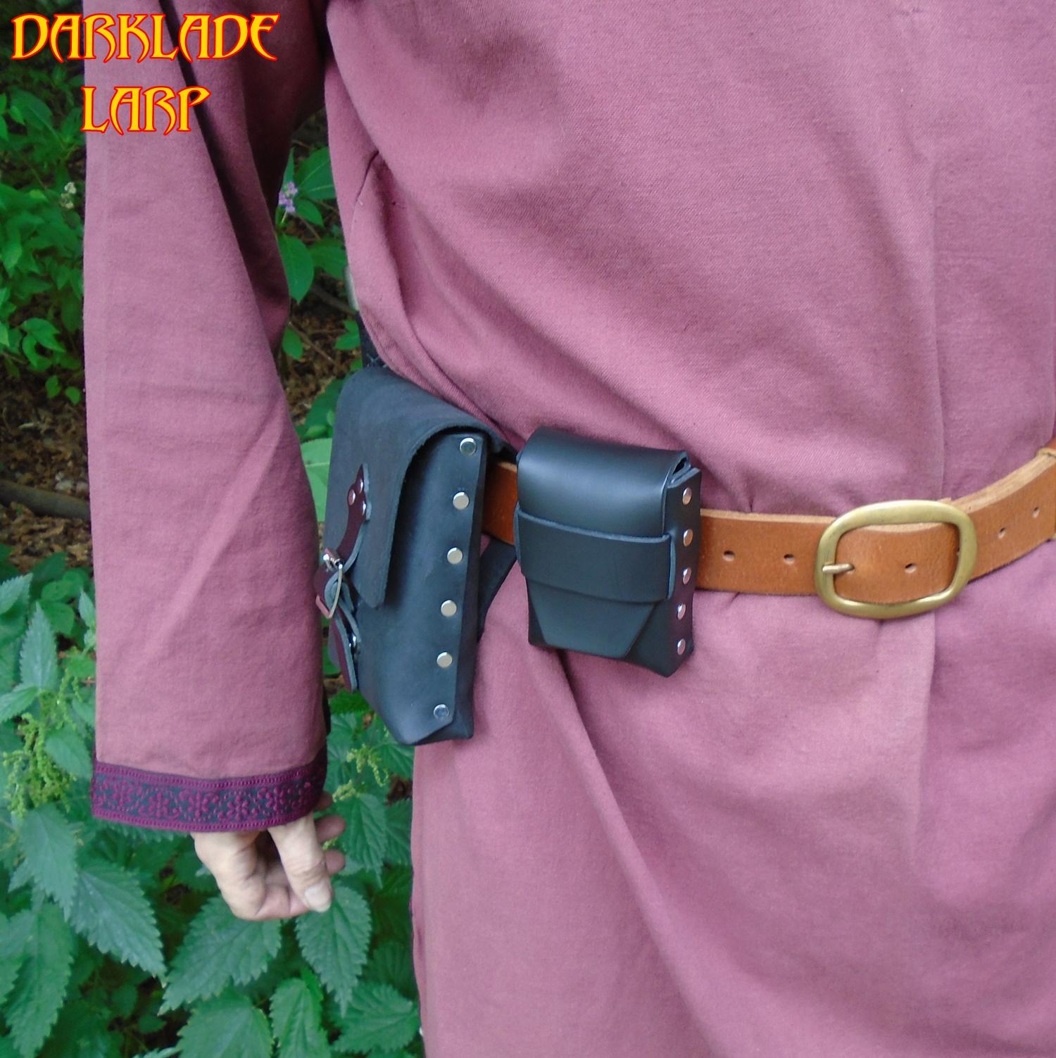 Small rectangular pouch being worn on a belt