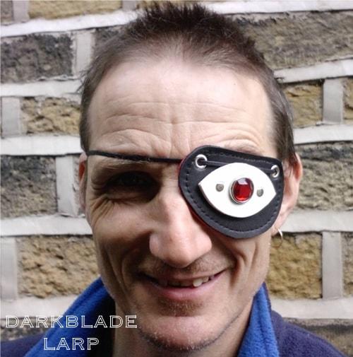 An eyepatch with a gemstone on the outside