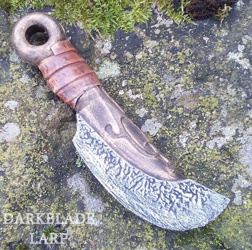 A small throwing knife with a curved blade