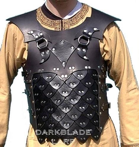 Black leather armour. The top part is a solid piece. The bottom part looks like lots of small scales