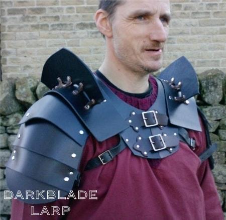 shoulder armour made of overlapping plates with extra plates sticking up out the shoulder