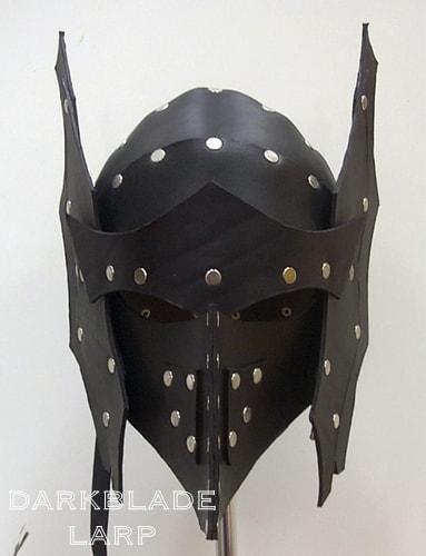 a leather helmet designed to look like a dragon's head