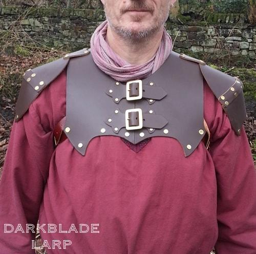 Heavy leather armour covering the upper chest and shoulders