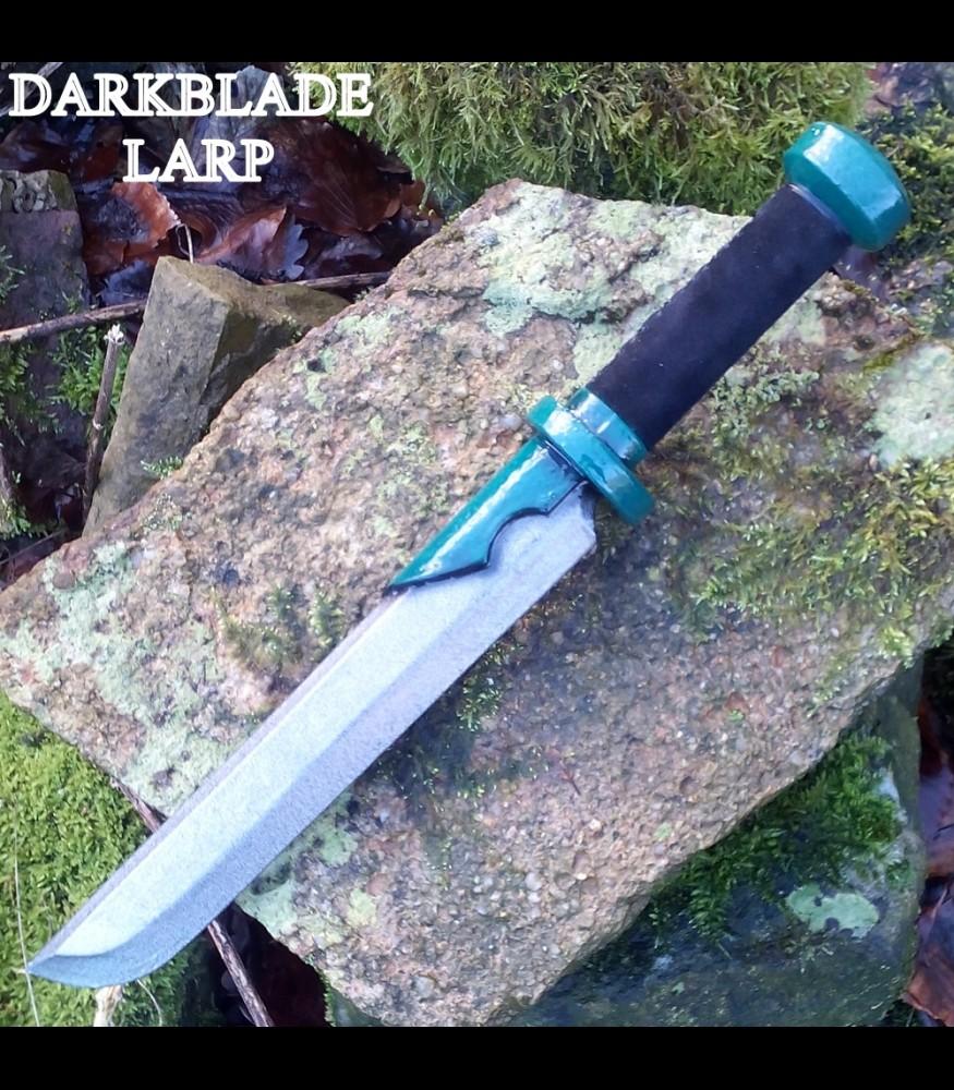 An elven style dagger with green embelishments