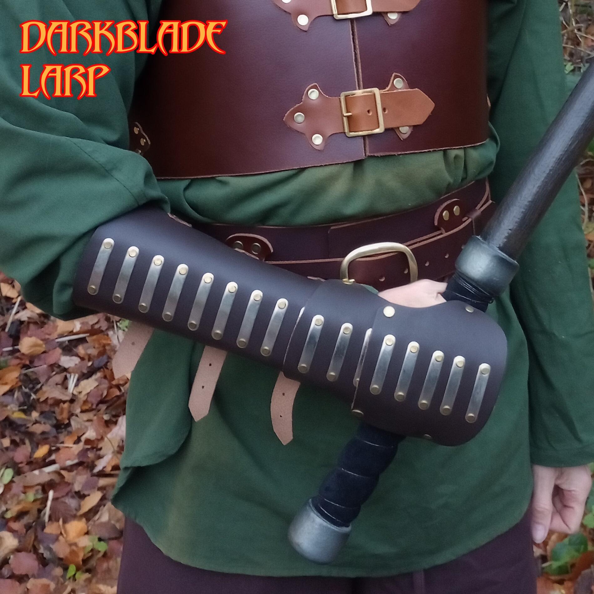 long arm guards with atriculated sections extending over the wrist and hand holding a mace