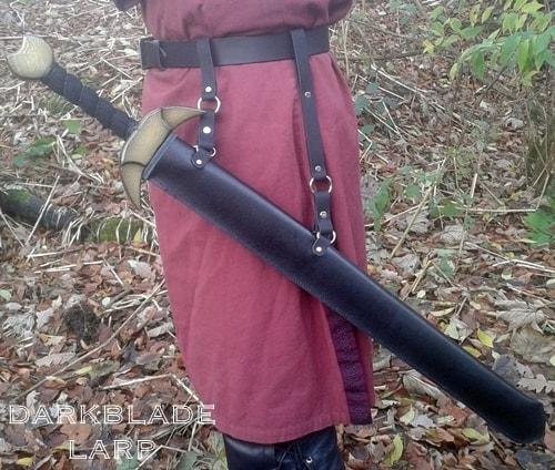 A ful sword scabbard with a sword in it