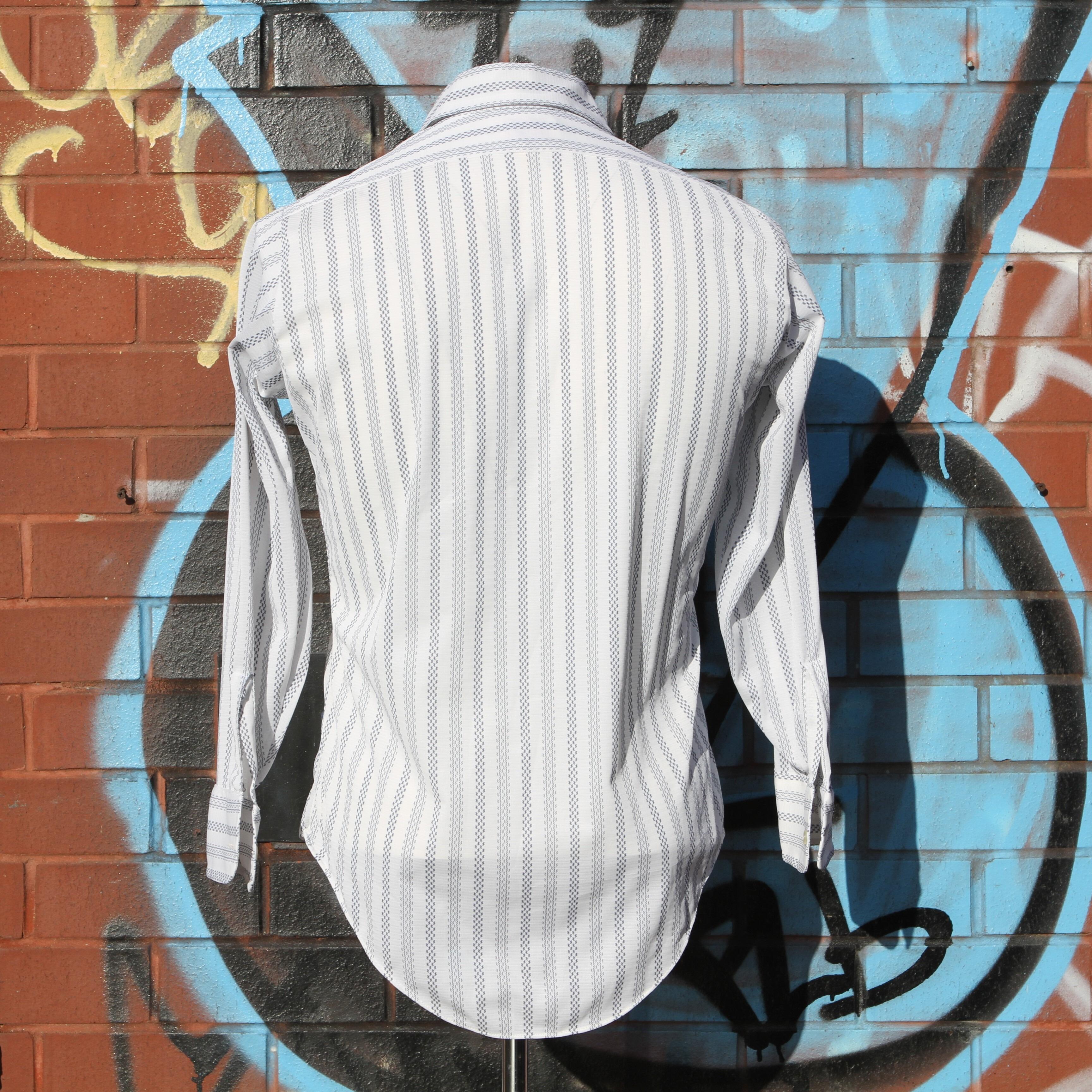 rear view of a Cool Arrow dectolene knit shirt with geometric pattern