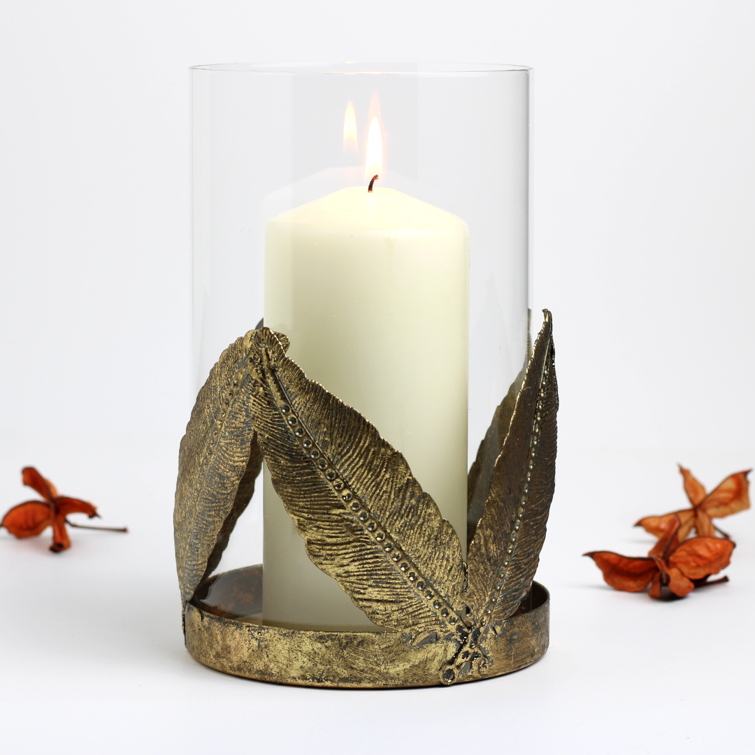 vintage gold hurricane lantern with pillar candle