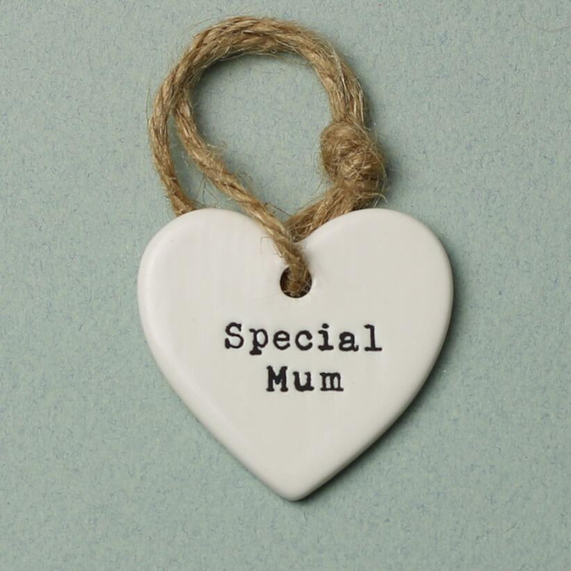 White ceramic heart shaped hanging decoration with the words special mum