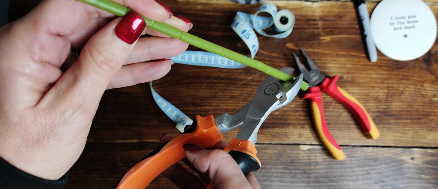 Cutting fake flower stems with wire cutters