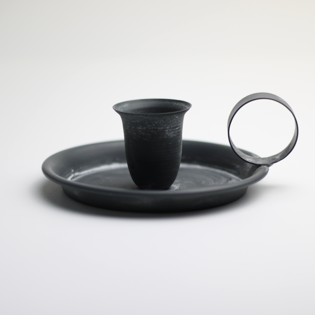 traditional chamberstick candle holder with wide drip pan and handle