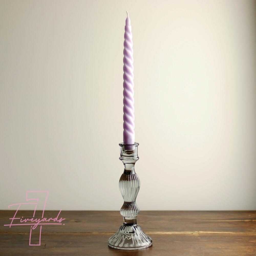 Grey glass candle stick holder with pink dinner candle