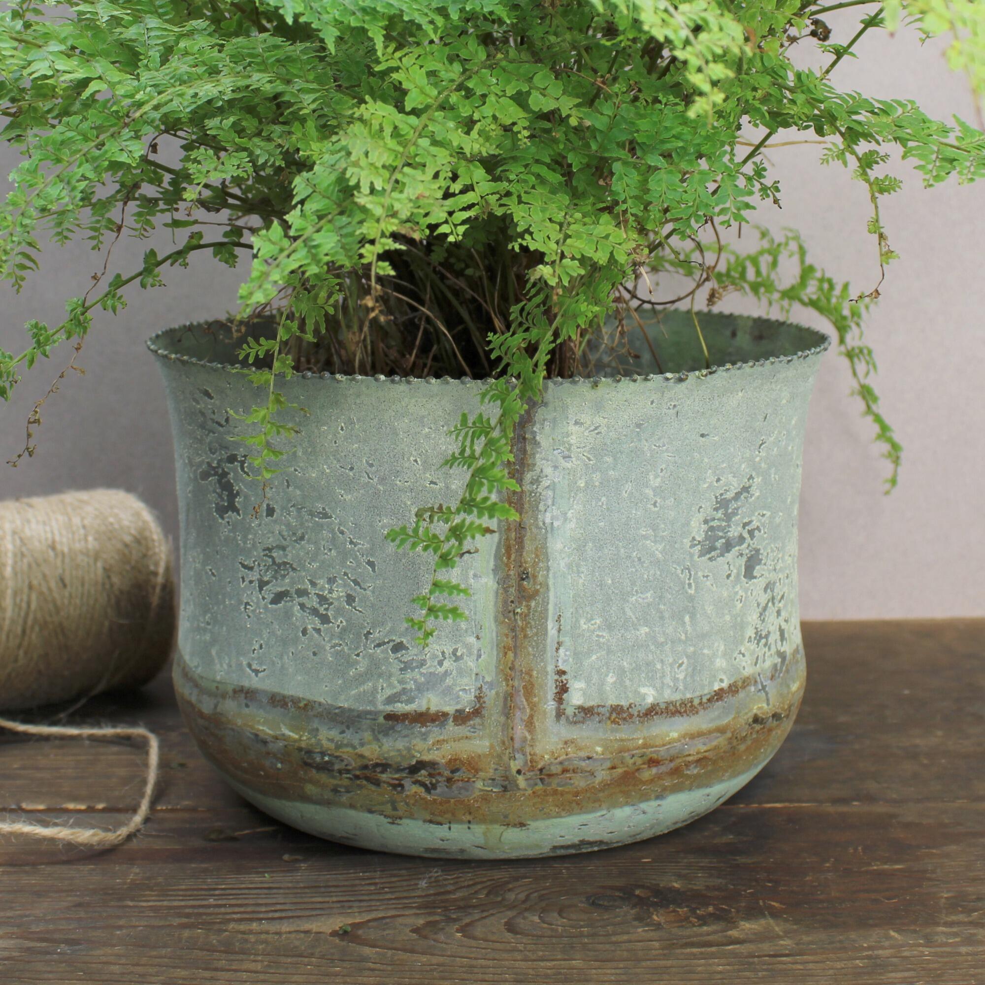 Farmhouse decor cachepot, unique round metal container with antique style weathered finish.
