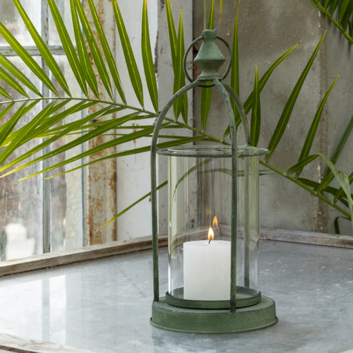 Green vintage style hurricane candle lantern