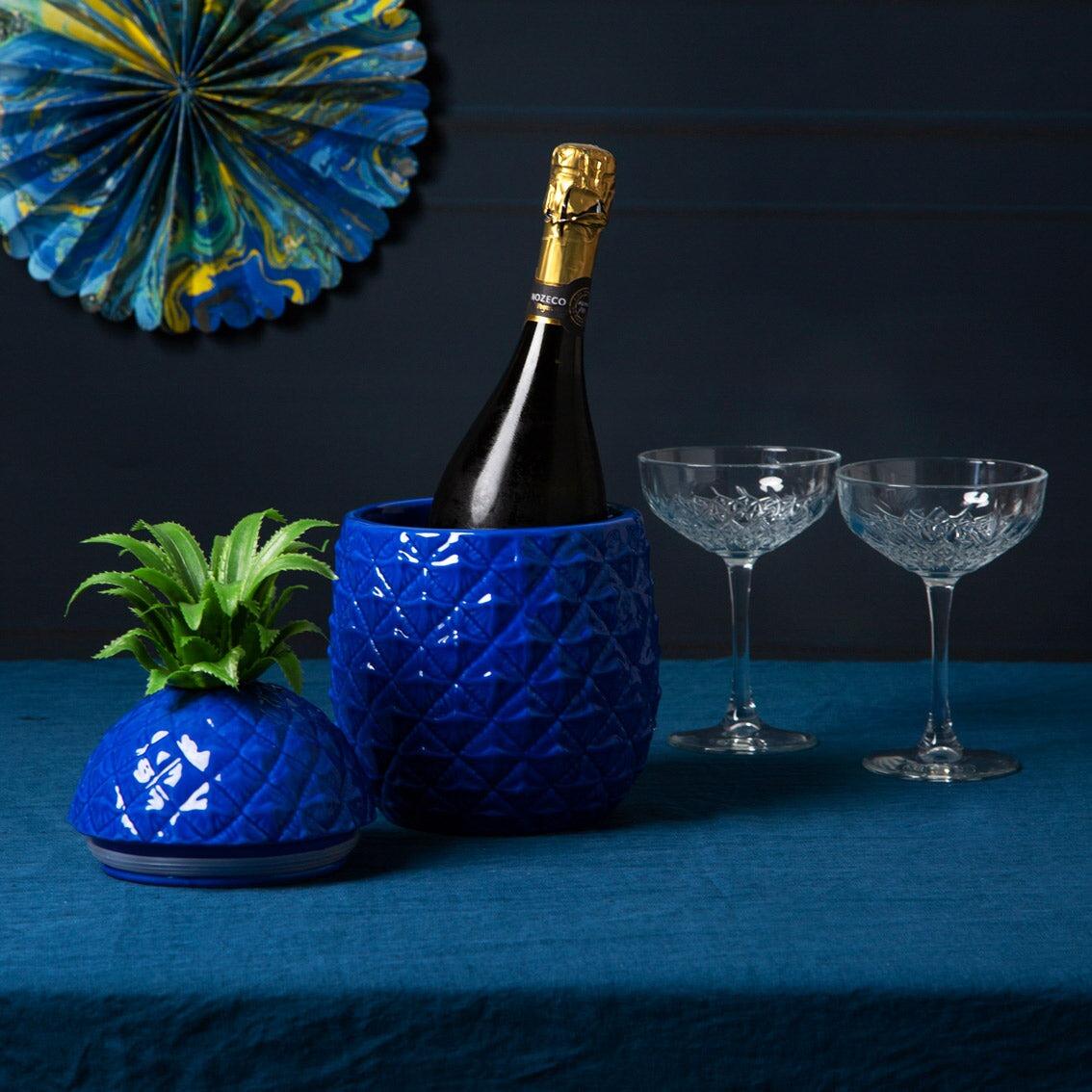 Blue pineapple ice bucket used as a champagne bucket