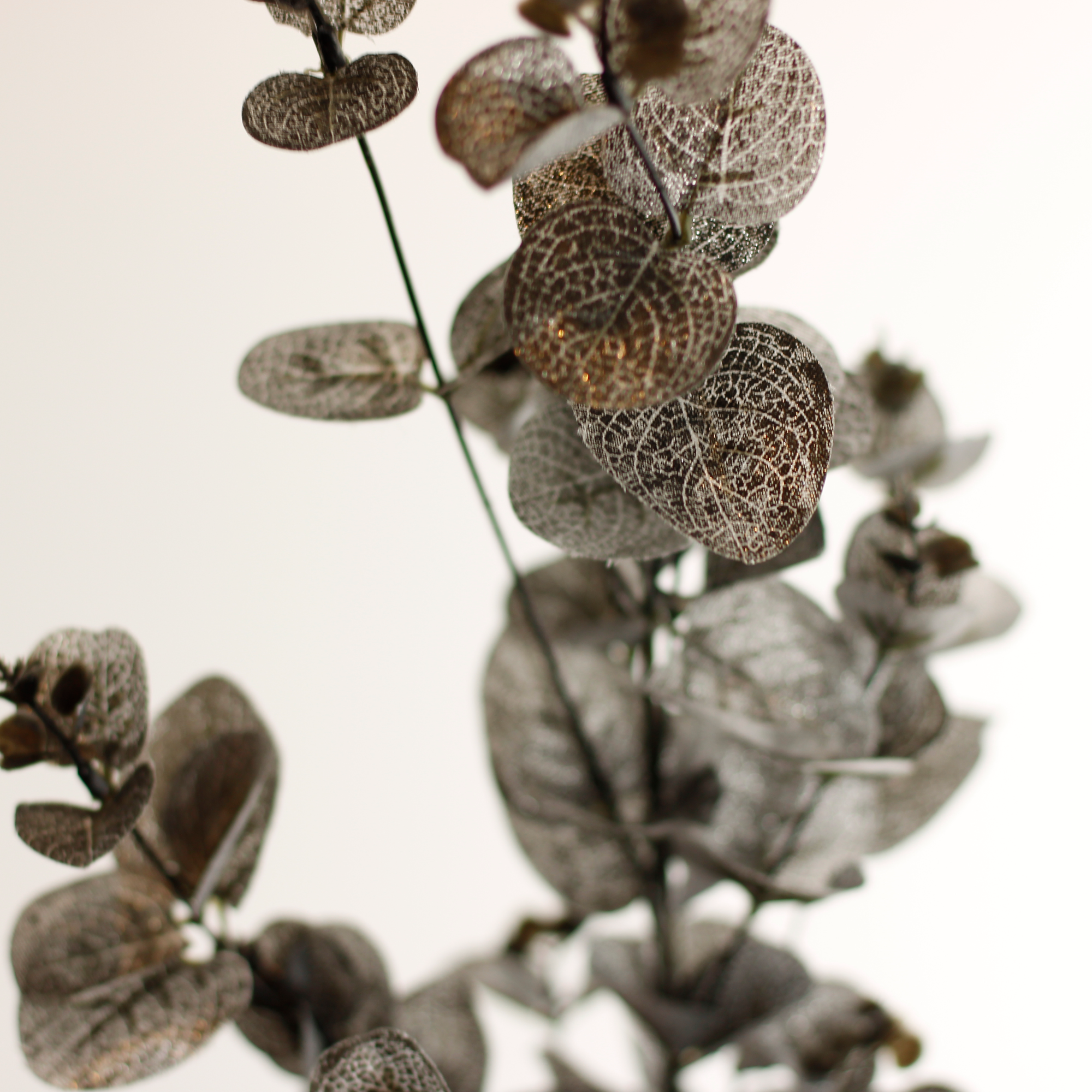 Decorative faux eucalyptus branch for Christmas arrangements and autumn styling