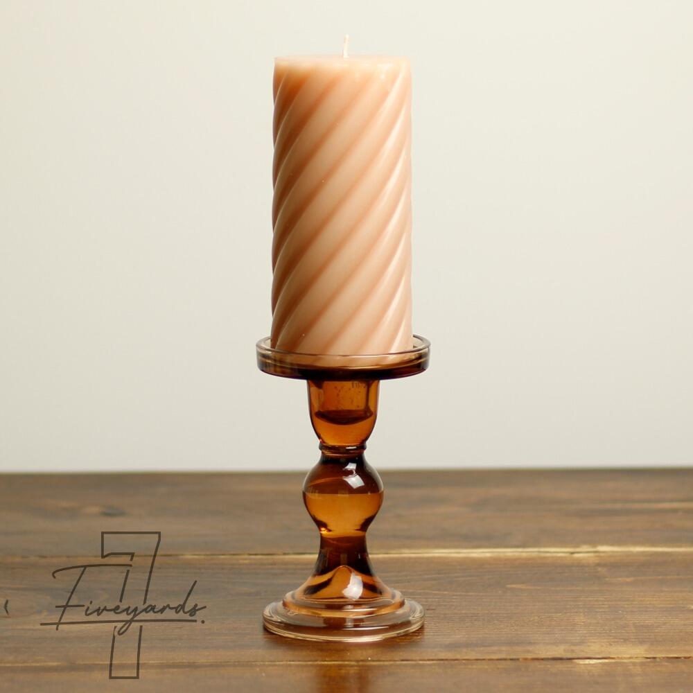 Brown transparent glass candle holder with pillar candle
