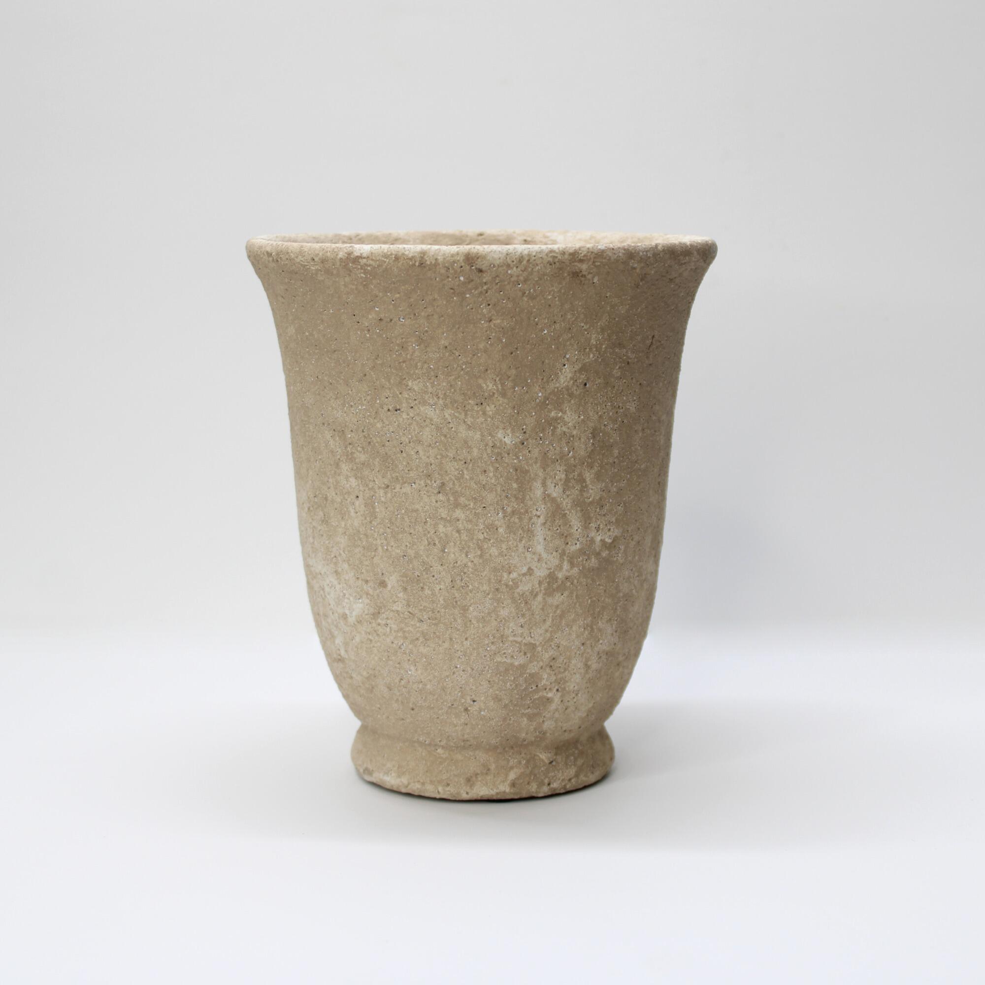 Rustic Wabi-Sabi style concrete urn with a flared rim and weathered pockmarked finish for indoor plants.