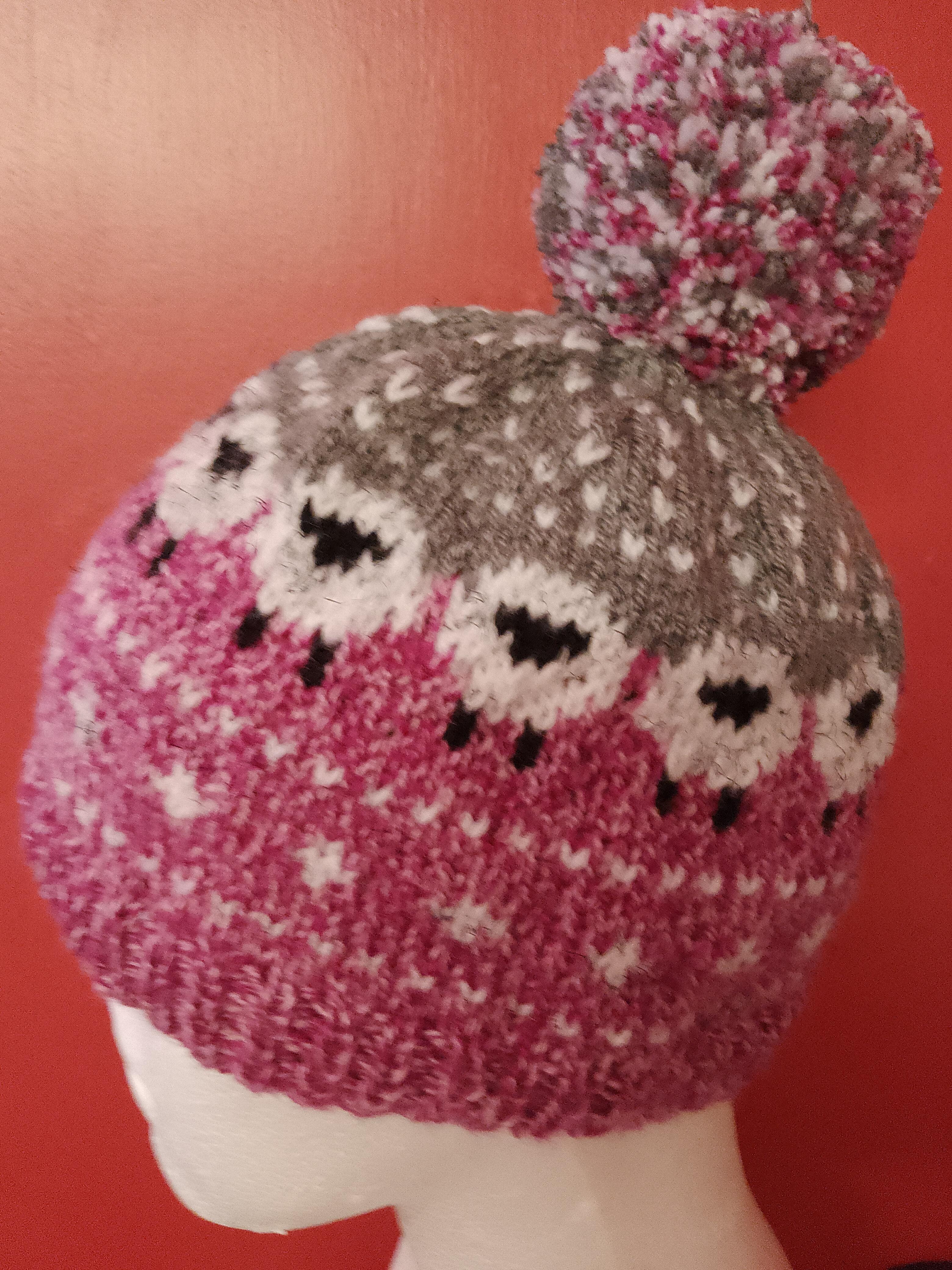 Mottled pink and grey hat with sheep