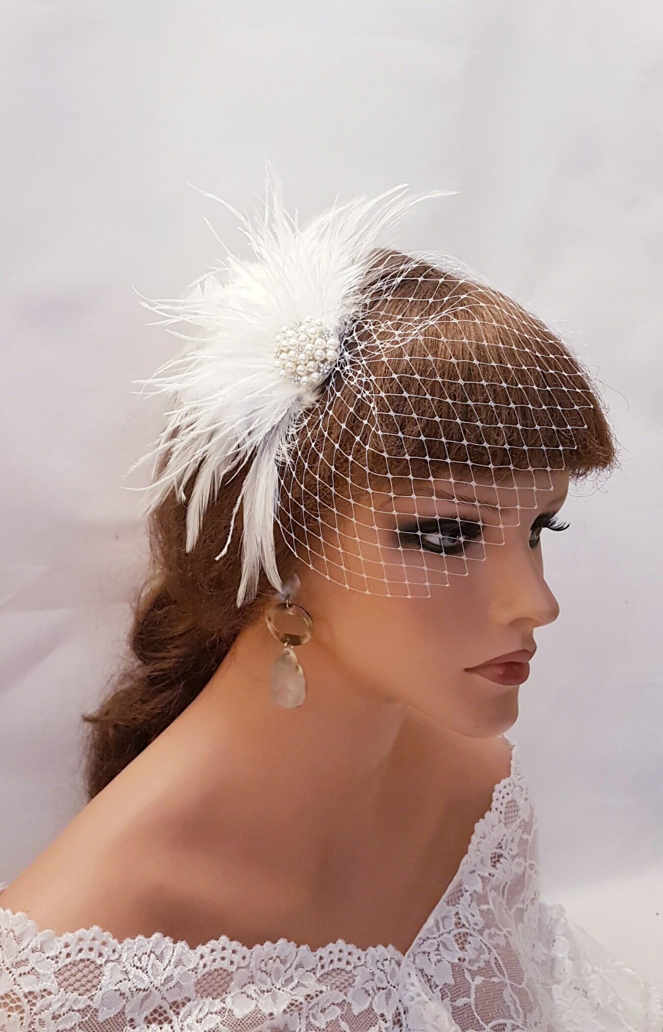Bridal birdcage veil with feather fascinator