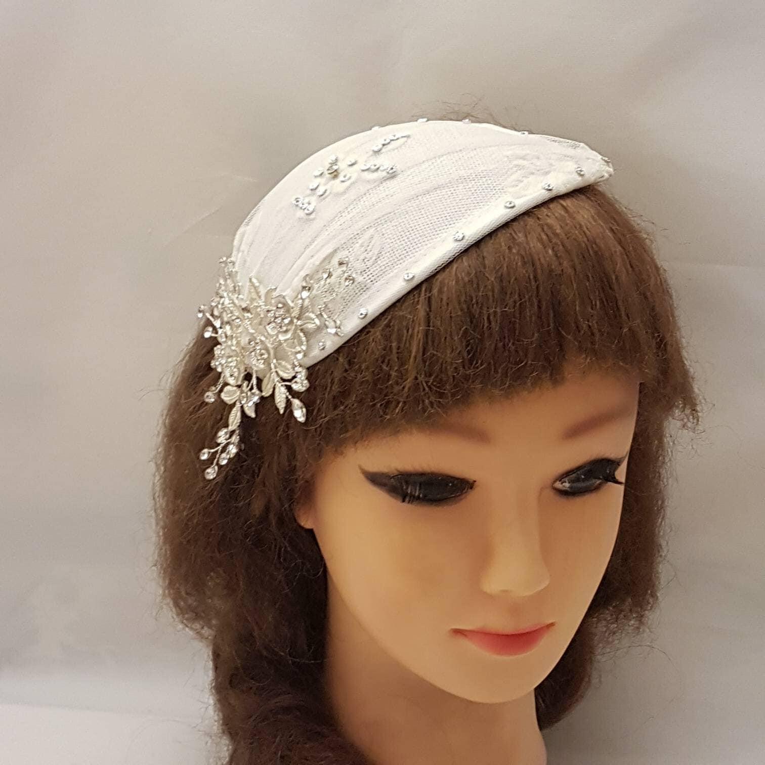 Bridal fascinator with mini birdcage veil