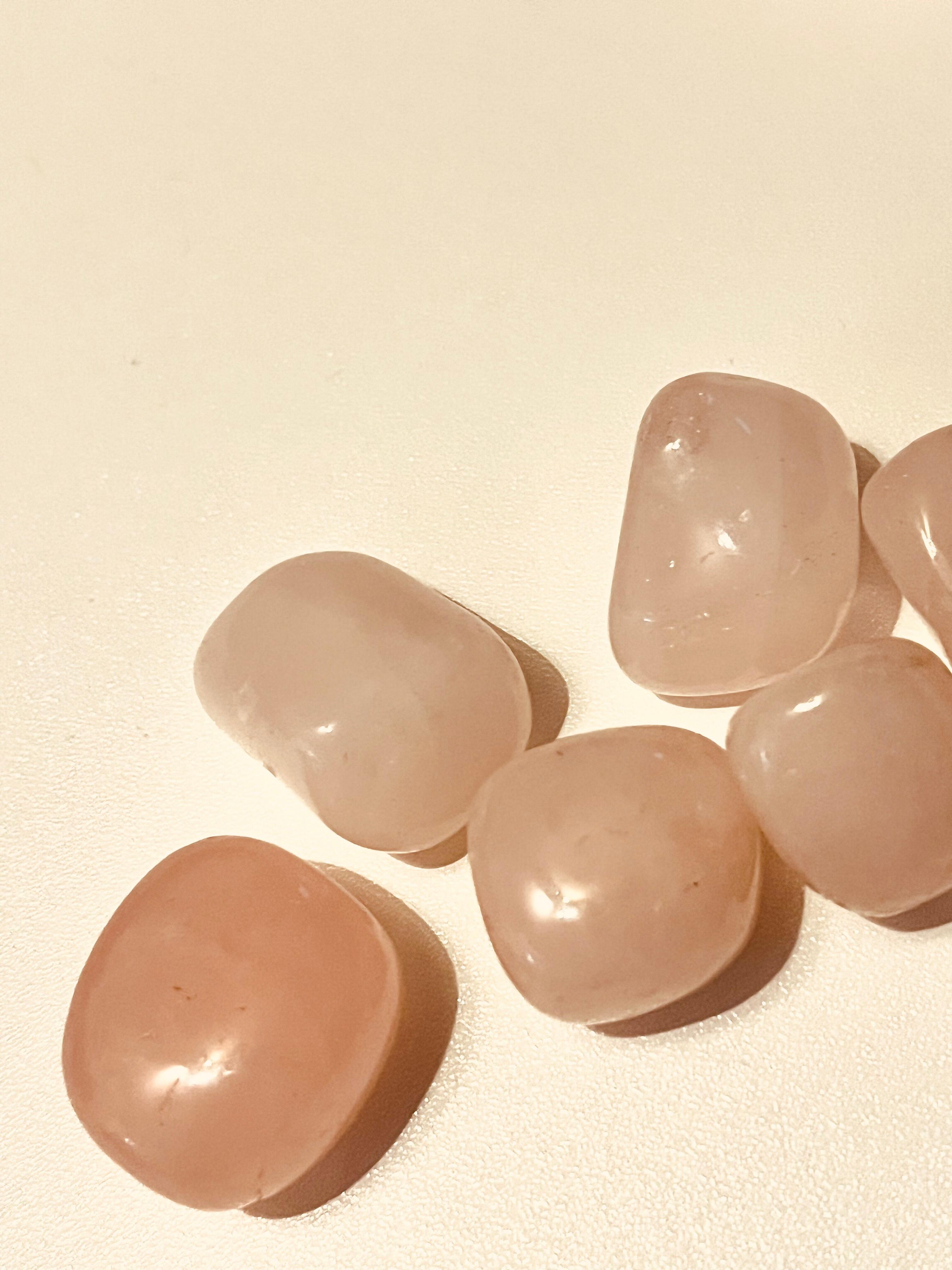 Pink Rose Quartz tumblestone on a table for love
