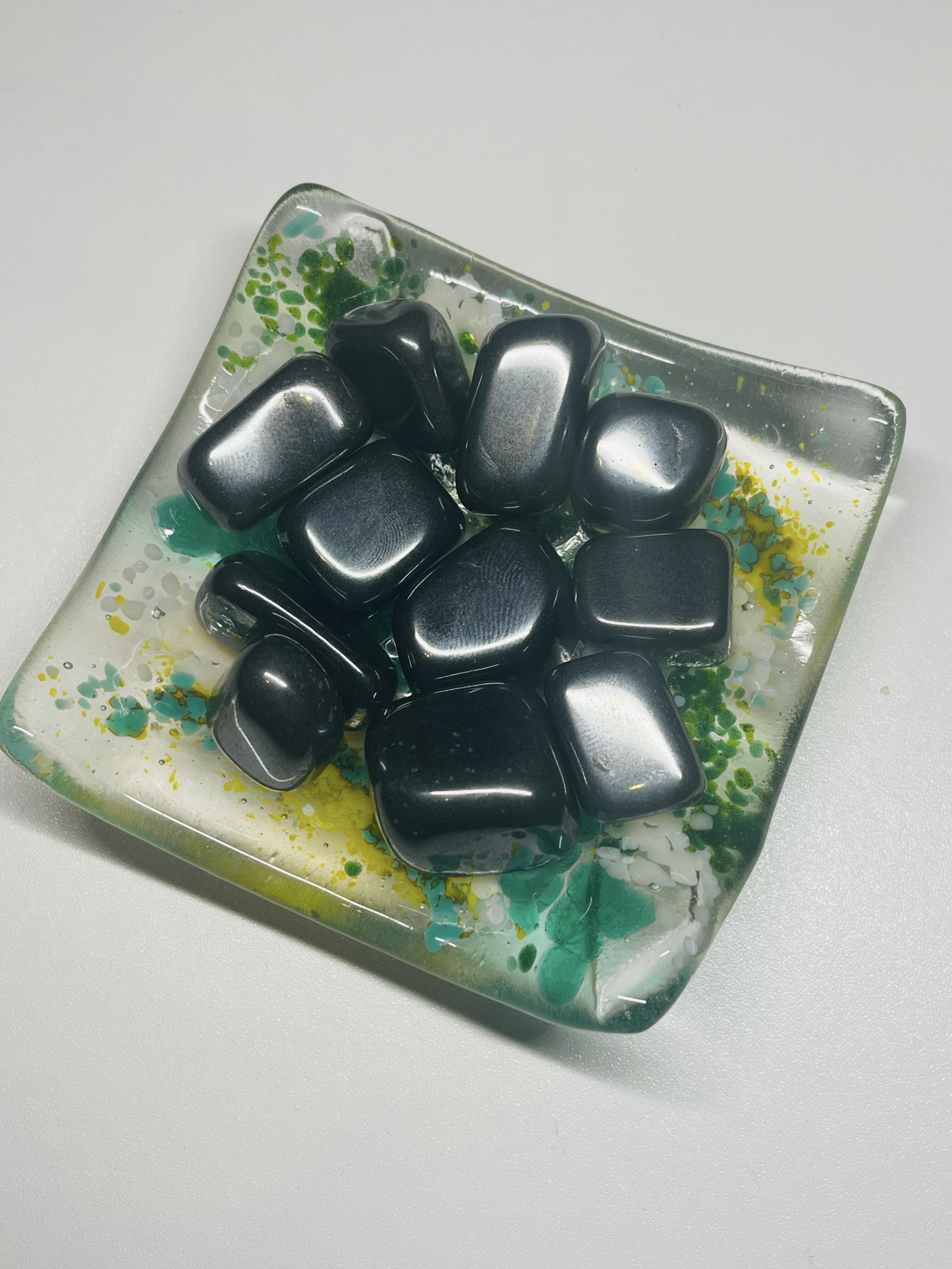 Lots of Hematite Tumbles Crystal Stones on white background