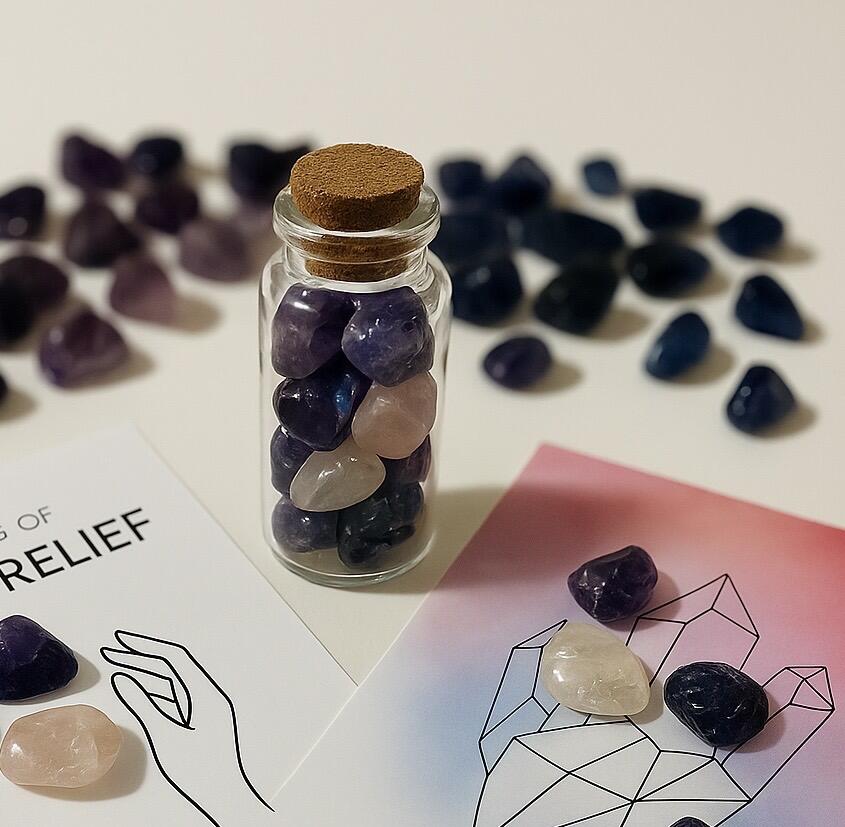 Crystal chips jar filled with crystals and some chips around it