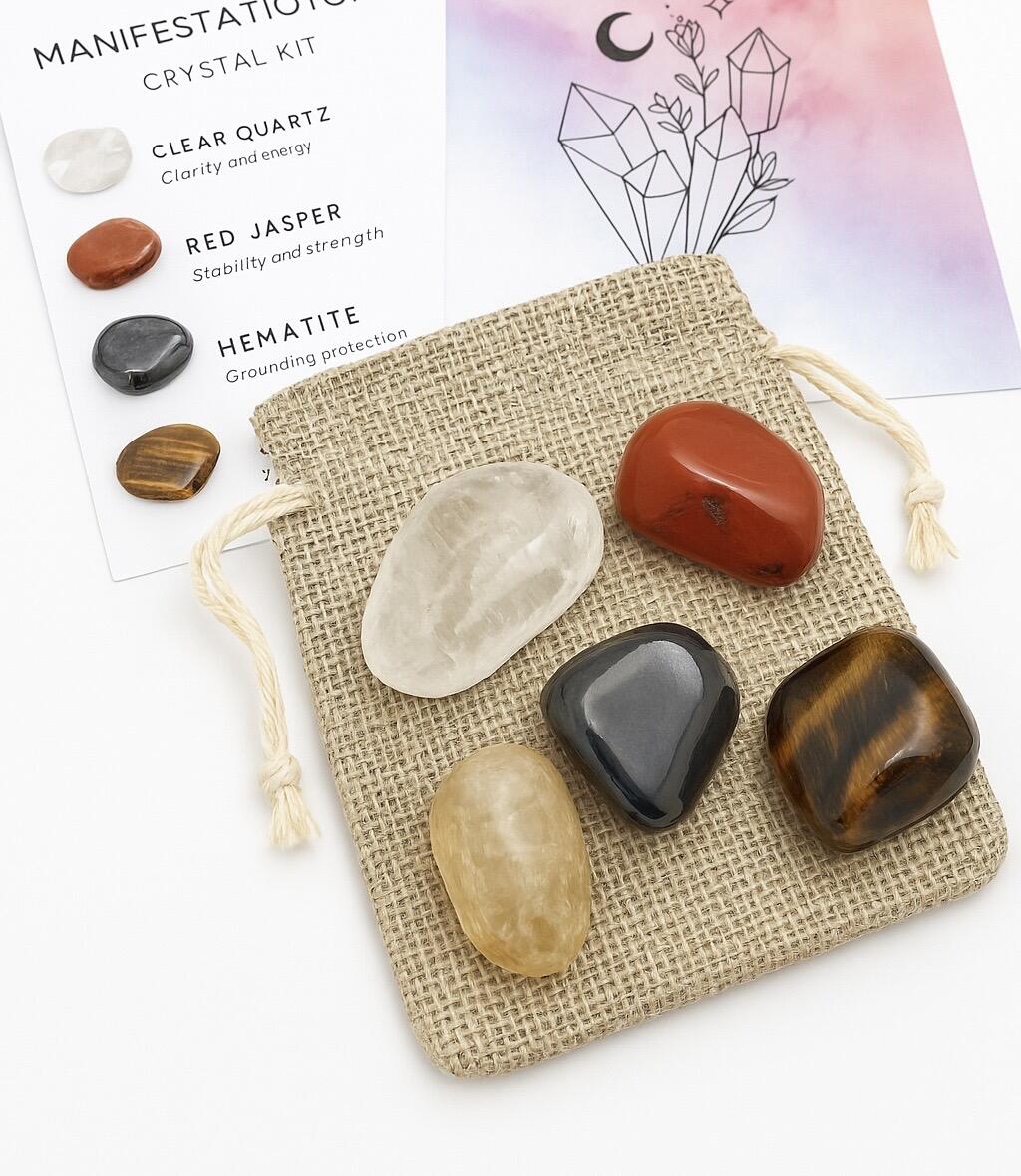 Manifestation Mastery Crystal set, five displayed on top of a bag