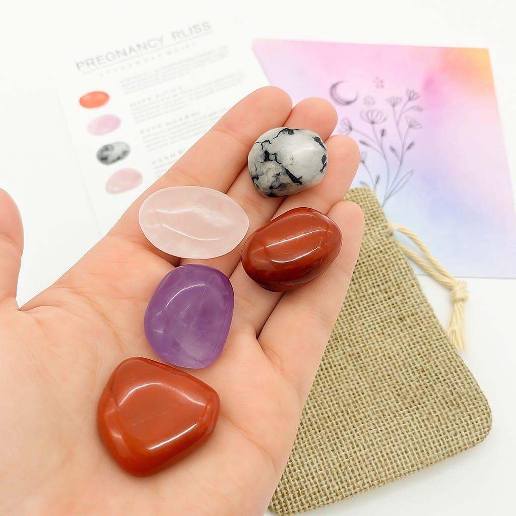 Pregnancy Bliss Crystal Kit with five different crystals in the palm of a hand